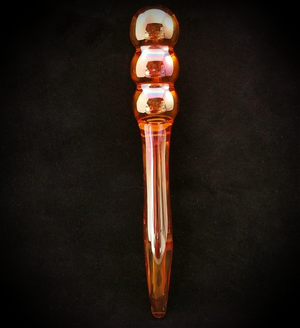 A sexy massager in stunning iridescent amber glass ... imagine the sleek contours of the warm glass on oiled skin.  Designed with sensual play in mind.