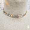 Bold and dramatic, and oh so sexy, this BDSM locking submissive collar will get plenty of attention. Yet it's so totally discreet, no one will ever know. Perfect statement of ownership for kittens, subs and slaves.   This wire wrapped collar is created in sterling silver, and has faceted sterling, 14k yellow and rose gold filled beads incorporated into the collar. With it's rounded, hand sculpted shape, this collar is very comfortable.   