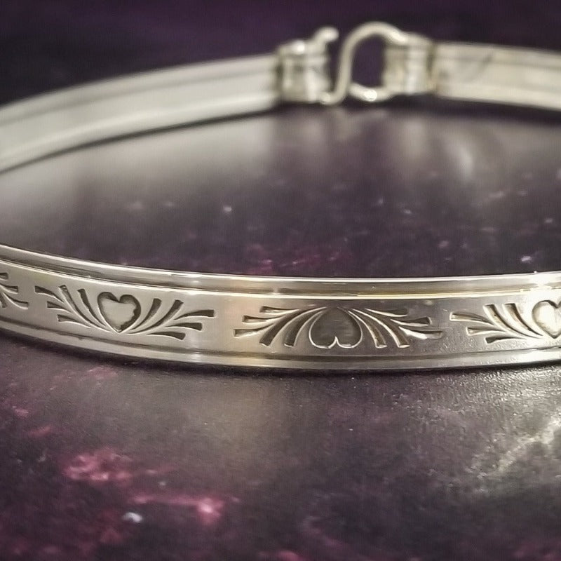 Sterling Silver BDSM Locking submissive collar symbolic of our crazy, chaotic hearts. Pretty for days, yet turns naughty when locked.The handcrafted sterling silver 'day clasp' offers discreet day wear, while the padlock allows for the jewelry to be transformed into a unique and stunning submissive piece. The locked collar is symbolic of chaotic hearts and can be worn in the front or back.