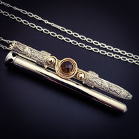An BDSM gemstone necklace with a kinky secret. The ultimate luxury, this beauty is unlike any jewelry you've seen! The sterling silver cage holds a sleek and sexy stainless steel vibrator. So discreet, no one will ever guess. 