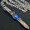 An artisan gemstone necklace with a kinky secret!  The sterling silver pendant cages a sleek and sexy vibrator. So discreet, no one will ever guess. Think of all the fun you can have with this wicked little toy! 