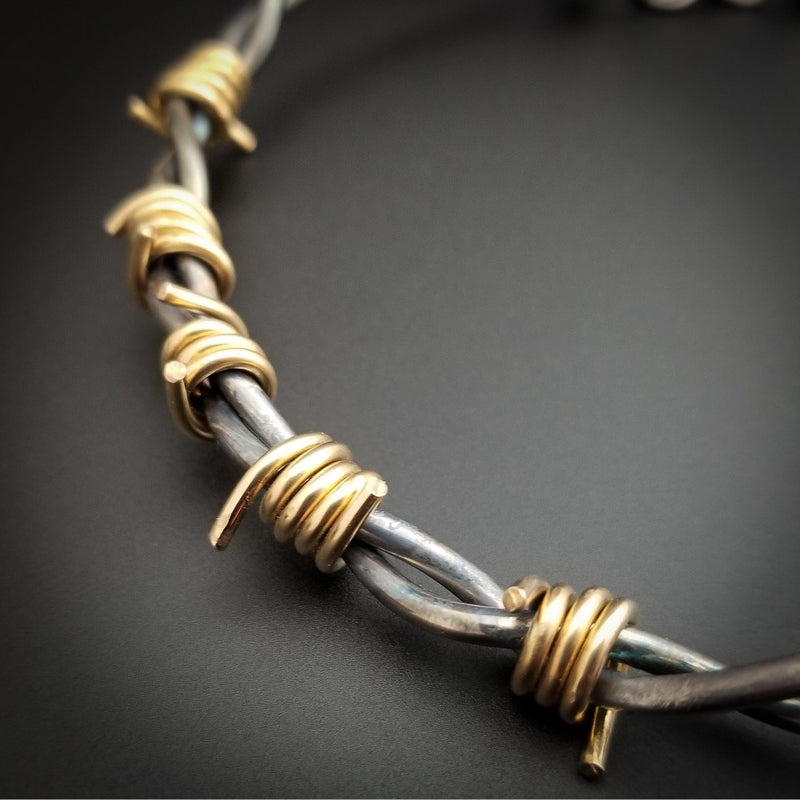 Our version of a Barbed Wire Collar, this beast is from our Brambles Collection, inspired by barbs, thorns and prickly things. This BDSM LOCKING SUBMISSIVE COLLAR is thick, hefty and truly badass. I create the barbs with comfort in mind, they're smooth and aren't long enough to do real damage, but still just a touch dangerous ;D