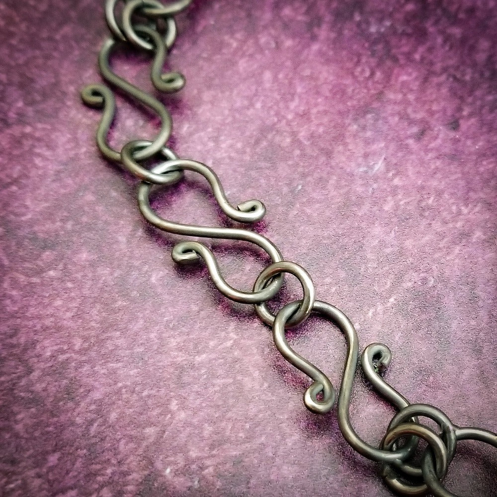 Our version of a Barbed Wire Collar, this beast is from our Brambles Collection, inspired by barbs, thorns and prickly things. This BDSM LOCKING SUBMISSIVE COLLAR is thick, hefty and truly badass. I create the barbs with comfort in mind, they're smooth and aren't long enough to do real damage, but still just a touch dangerous ;D