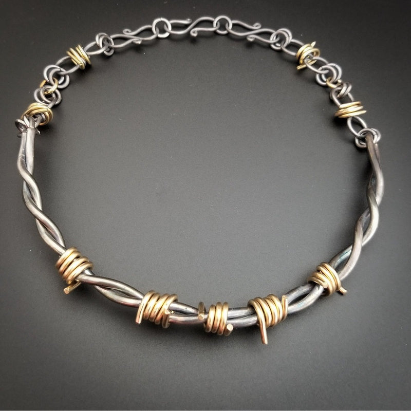 Our version of a Barbed Wire Collar, this beast is from our Brambles Collection, inspired by barbs, thorns and prickly things. This BDSM LOCKING SUBMISSIVE COLLAR is thick, hefty and truly badass. I create the barbs with comfort in mind, they're smooth and aren't long enough to do real damage, but still just a touch dangerous ;D