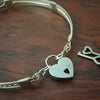 Sterling submissive collar that is discreet for daytime, yet kinky for playtime. The Celtic inspired design features a rope pattern, with accent lines of sterling and 14k gold filled, all wrapped together with sterling wraps. 