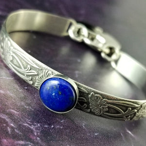 Silver and Lapis. What a luxurious way to show your Ownership / submission. Beautifully feminine and romantic locking handcuffs or anklets. This addition to our SOFT and SWEET Collection is created in precious metals and and all natural gemstones accented with coordinating wire accents. BDSM has never been so luxurious.