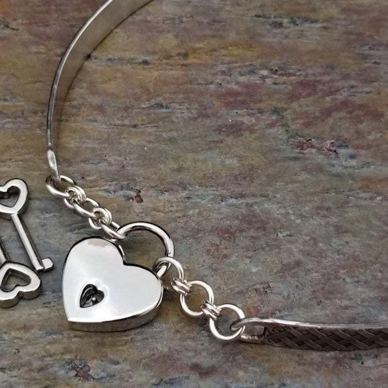 Our Darkenwald design is reminiscent of old castle walls, knights on galloping horses and laughter and ale in the great hall by firelight. Substantial sterling silver collar accommodates a traditional clasp for discretion, but can also be worn with a padlock and key for a big statement of Ownership.