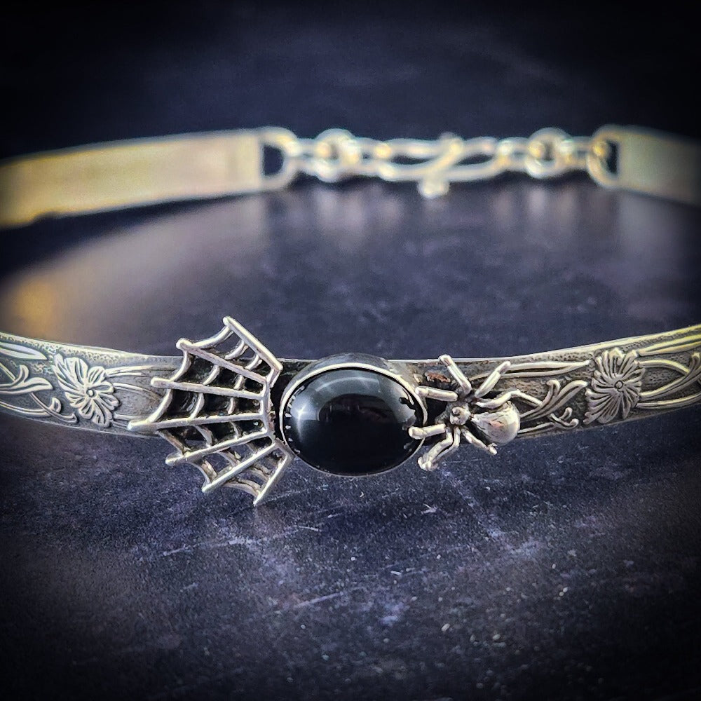 We've taken our best seller and added a Gothic flair for Spook Season ... Features a smooth black onyx cabochon surrounded by a spider and cobweb