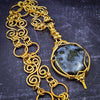 This beautifully discreet BDSM locking submissive soft collar features handcrafted Infinity links made of 14k yellow gold filled wire.