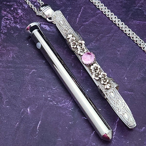 An artisan gemstone necklace with a kinky secret! The sterling silver pendant cages a sleek and sexy vibrator. So discreet, no one will ever guess. Think of all the fun you can have with this wicked little toy!