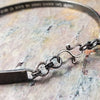 Share a secret. Rune font creates a unique collar with a secret message. The outside inscription is engraved in Rune symbols for Submissive, and the inside is engraved  with your choice of inscription