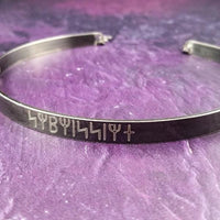 Share a secret. Rune font creates a unique collar with a secret message. The outside inscription is engraved in Rune symbols for Submissive, and the inside is engraved  with your choice of inscription