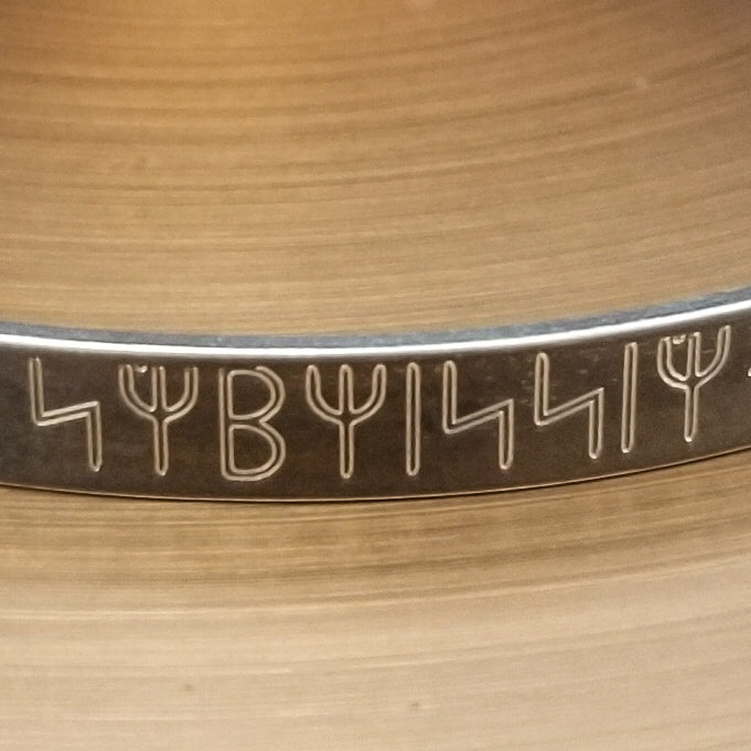 Share a secret. Rune font creates a unique collar with a secret message. The outside inscription is engraved in Rune symbols for Submissive, and the inside is engraved  with your choice of inscription