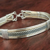 Our Rigger Collection is themed around ropes, paying homage to the ancient art of shibari. Designed for the Dominant, this bracelet has a traditional hook clasp. Created with sterling with slim bands of 14k gold filled accents.