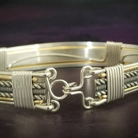 Our Rigger Collection is themed around ropes, paying homage to the ancient art of shibari. Designed for the Dominant, this bracelet has a traditional hook clasp. Created with sterling with slim bands of 14k gold filled accents.