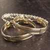 Our Rigger Collection is themed around ropes, paying homage to the ancient art of shibari. These locking BDSM submissive bracelets are so beautifully discreet.  Created in sterling with slim bands of 14k gold filled accents. Can be worn as wrist or ankle restraints. 
