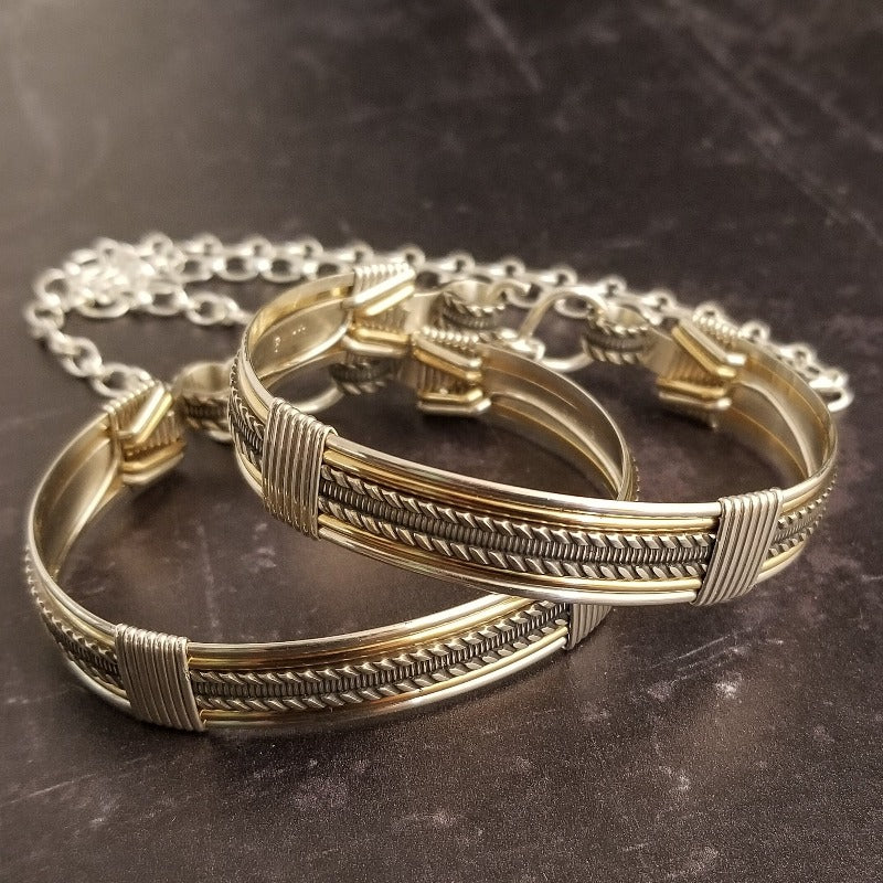 Our Rigger Collection is themed around ropes, paying homage to the ancient art of shibari. These locking BDSM submissive bracelets are so beautifully discreet.  Created in sterling with slim bands of 14k gold filled accents. Can be worn as wrist or ankle restraints. 
