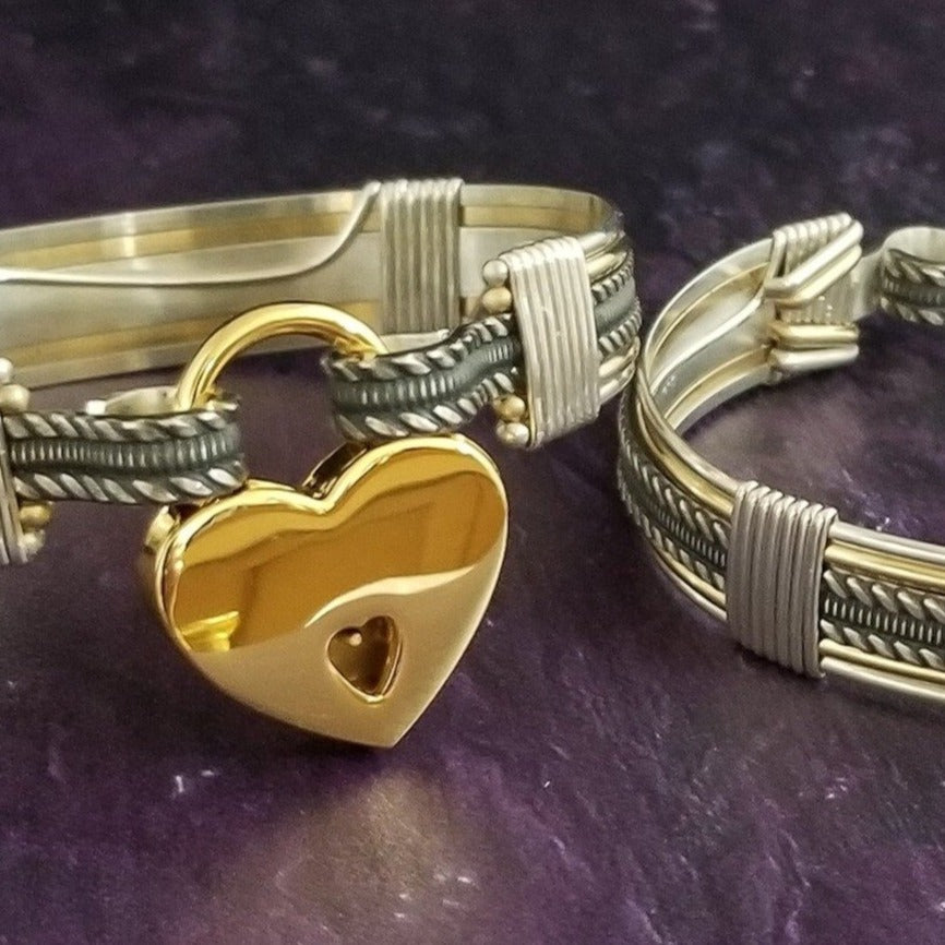 Our Rigger Collection is themed around ropes, paying homage to the ancient art of shibari. These locking BDSM submissive bracelets are so beautifully discreet.  Created in sterling with slim bands of 14k gold filled accents. Can be worn as wrist or ankle restraints. 
