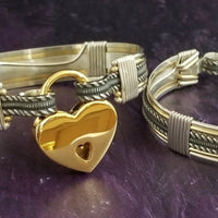 Our Rigger Collection is themed around ropes, paying homage to the ancient art of shibari. These locking BDSM submissive bracelets are so beautifully discreet.  Created in sterling with slim bands of 14k gold filled accents. Can be worn as wrist or ankle restraints. 