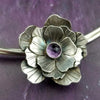 Why wear the same submissive collar everyday? With these collar slides, you can adorn your sub or yourself with a mix beautiful flowers and gemstones, and choose a different look everyday. With our Jardin Collection, you can make a beautifully discreet statement of Ownership or submission of your BDSM D/s or M/s relationship. Choose one flower, two or three flowers, choose your gemstones, and choose your flower.