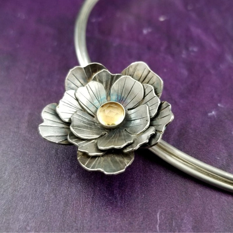 Why wear the same submissive collar everyday? With these collar slides, you can adorn your sub or yourself with a mix beautiful flowers and gemstones, and choose a different look everyday. With our Jardin Collection, you can make a beautifully discreet statement of Ownership or submission of your BDSM D/s or M/s relationship. Choose one flower, two or three flowers, choose your gemstones, and choose your flower.