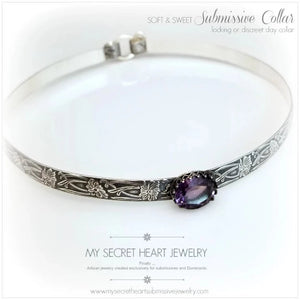This Soft and Sweet artisan submissive collar is handcrafted in a floral pattern of sterling silver set with a 12 x 10mm simulated faceted amethyst gemstone.  By My Secret Heart Studios