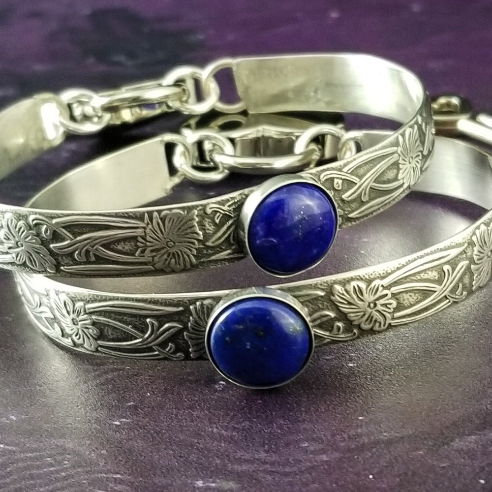 Silver and Lapis. What a luxurious way to show your Ownership / submission. Beautifully feminine and romantic locking handcuffs or anklets. This addition to our SOFT and SWEET Collection is created in precious metals and and all natural gemstones accented with coordinating wire accents. BDSM has never been so luxurious.