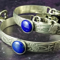 Silver and Lapis. What a luxurious way to show your Ownership / submission. Beautifully feminine and romantic locking handcuffs or anklets. This addition to our SOFT and SWEET Collection is created in precious metals and and all natural gemstones accented with coordinating wire accents. BDSM has never been so luxurious.