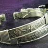 Our best-selling design ... Show your ownership/submission with style and grace. The Soft and Sweet Submissive Collection is the epitome of feminine beauty. This timeless floral pattern is solid sterling silver and hand wrapped with sterling silver accents. Worn as discreet, beautiful matching bracelets, no one will know your secret. 