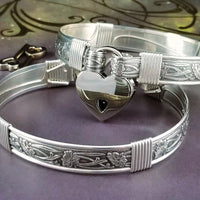Our best-selling design ... Show your ownership/submission with style and grace. The Soft and Sweet Submissive Collection is the epitome of feminine beauty. This timeless floral pattern is solid sterling silver and hand wrapped with sterling silver accents. Worn as discreet, beautiful matching bracelets, no one will know your secret. 