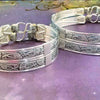 Our best-selling design ... Show your ownership/submission with style and grace. The Soft and Sweet Submissive Collection is the epitome of feminine beauty. This timeless floral pattern is solid sterling silver and hand wrapped with sterling silver accents. Worn as discreet, beautiful matching bracelets, no one will know your secret. 