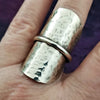 Minimalist style meets a bold design. Inspired to be a bold statement alone, yet will compliment any and all of your other jewelry. The top medallion is hand cut and hammered, then wrapped with a slim band of silver. It curves and hugs the top and sides of the finger for a all-day comfortable fit. 