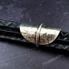 Minimalist style meets a bold design. Inspired to be a bold statement alone, yet will compliment any and all of your other jewelry. The top medallion is hand cut and hammered, then wrapped with a slim band of silver. It curves and hugs the top and sides of the finger for a all-day comfortable fit. 