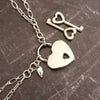 A beautiful symbol of your D/s dynamic, this contemporary V Style Locking BDSM submissive collar is hand crafted in mixed precious metals of sterling silver and gold. As strong and beautiful as the submissive’s heart, this high-quality artisan collar is made to last and will be the foundation of your private collection