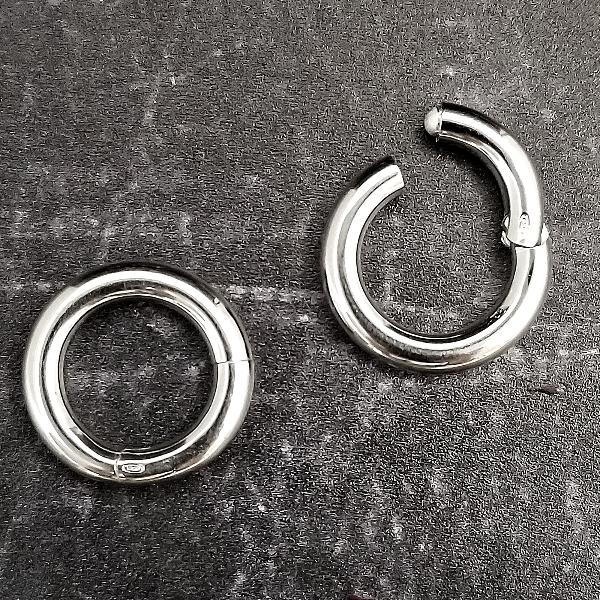 Use this snap-close clasp to turn your Secret Heart submissive collars or cuff bracelets into day wear for the vanilla world. Just slip it through the metal loops and snap closed.