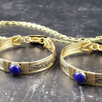 Gold and Lapis. What a luxurious way to show your Ownership / submission. Beautifully feminine and romantic locking handcuffs or anklets. This addition to our SOFT and SWEET Collection is created in precious metals and and all natural gemstones accented with coordinating wire accents. BDSM has never been so luxurious.