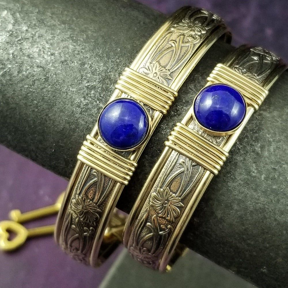 Gold and Lapis. What a luxurious way to show your Ownership / submission. Beautifully feminine and romantic locking handcuffs or anklets. This addition to our SOFT and SWEET Collection is created in precious metals and and all natural gemstones accented with coordinating wire accents. BDSM has never been so luxurious.