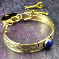 Gold and Lapis. What a luxurious way to show your Ownership / submission. Beautifully feminine and romantic locking handcuffs or anklets. This addition to our SOFT and SWEET Collection is created in precious metals and and all natural gemstones accented with coordinating wire accents. BDSM has never been so luxurious.