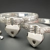 These artisan handcuffs / ankle restraints are hand crafted in a pretty feminine floral pattern that is the epitome of feminine grace. 