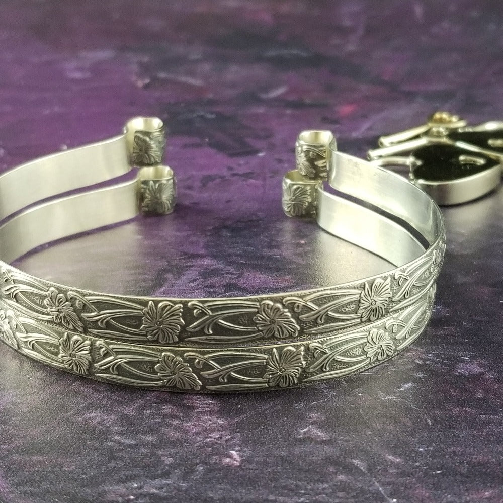 These artisan handcuffs / ankle restraints are hand crafted in a pretty feminine floral pattern that is the epitome of feminine grace. 