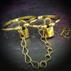 The Temel Submissive handcuff bracelets are a unique design that allows traditional jewelry cuffs to be quickly converted into locked handcuffs for gentle bedroom play. The simple designs compliments most any of the My Secret Heart submissive collars.