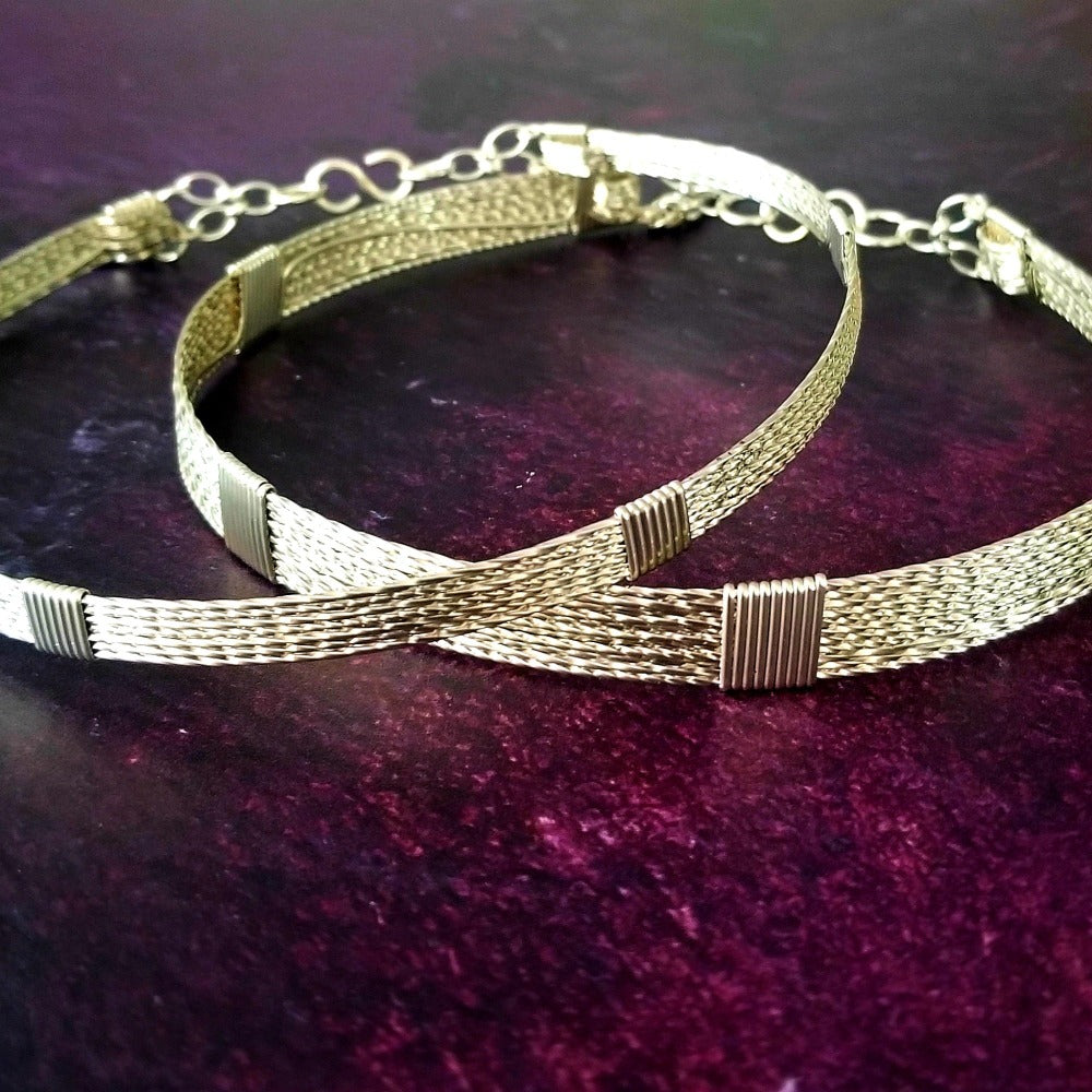 Showcase your power and taste with ASHANTI Slim Collar. This handcrafted collar is artfully crafted with twisted 14K gold filled wire and elevated with gold wraps. A touch of chain in the back ensures a snug fit, so you can move with ease. Wear ASHANTI TWISTED alone or layer it with other chains and pendants--it's the perfect foundation for building endless elegant looks! Plus, the locking collar takes your look up a notch. 