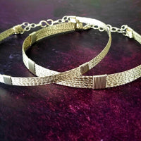 Showcase your power and taste with ASHANTI Slim Collar. This handcrafted collar is artfully crafted with twisted 14K gold filled wire and elevated with gold wraps. A touch of chain in the back ensures a snug fit, so you can move with ease. Wear ASHANTI TWISTED alone or layer it with other chains and pendants--it's the perfect foundation for building endless elegant looks! Plus, the locking collar takes your look up a notch. 