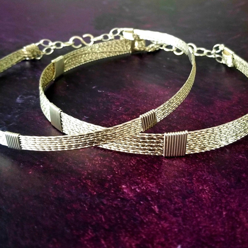 Showcase your power and taste with ASHANTI Slim Collar. This handcrafted collar is artfully crafted with twisted 14K gold filled wire and elevated with gold wraps. A touch of chain in the back ensures a snug fit, so you can move with ease. Wear ASHANTI TWISTED alone or layer it with other chains and pendants--it's the perfect foundation for building endless elegant looks! Plus, the locking collar takes your look up a notch. 