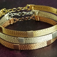 Showcase your power and taste with ASHANTI Slim Collar. This handcrafted collar is artfully crafted with twisted 14K gold filled wire and elevated with gold wraps. A touch of chain in the back ensures a snug fit, so you can move with ease. Wear ASHANTI TWISTED alone or layer it with other chains and pendants--it's the perfect foundation for building endless elegant looks! Plus, the locking collar takes your look up a notch. 