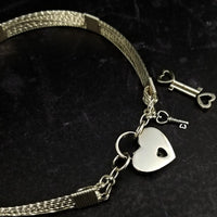 This ASHANTI Slim BDSM Submissive Collar is masterfully crafted from Sterling Silver, offering unparalleled artistry and lasting beauty. Its timeless design makes it the perfect addition to any BDSM enthusiast's collection, ensuring that you can cherish it for years to come.