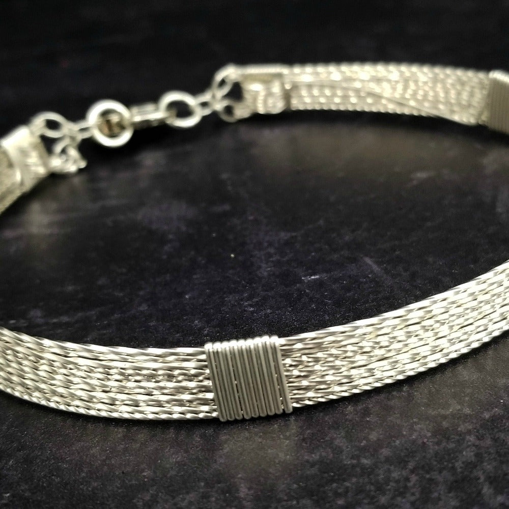 Showcase your power and taste with ASHANTI Slim Collar. This handcrafted collar is artfully crafted with twisted 14K gold filled wire and elevated with gold wraps. A touch of chain in the back ensures a snug fit, so you can move with ease. Wear ASHANTI TWISTED alone or layer it with other chains and pendants--it's the perfect foundation for building endless elegant looks! Plus, the locking collar takes your look up a notch. 