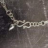 A beautiful symbol of your D/s dynamic, this contemporary V Style Locking BDSM submissive collar is hand crafted in mixed precious metals of sterling silver and gold. As strong and beautiful as the submissive’s heart, this high-quality artisan collar is made to last and will be the foundation of your private collection