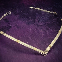 A beautiful symbol of your D/s dynamic, this contemporary V Style Locking BDSM submissive collar is hand crafted in mixed precious metals of sterling silver and gold. As strong and beautiful as the submissive’s heart, this high-quality artisan collar is made to last and will be the foundation of your private collection