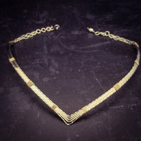 A beautiful symbol of your D/s dynamic, this contemporary V Style Locking BDSM submissive collar is hand crafted in mixed precious metals of sterling silver and gold. As strong and beautiful as the submissive’s heart, this high-quality artisan collar is made to last and will be the foundation of your private collection